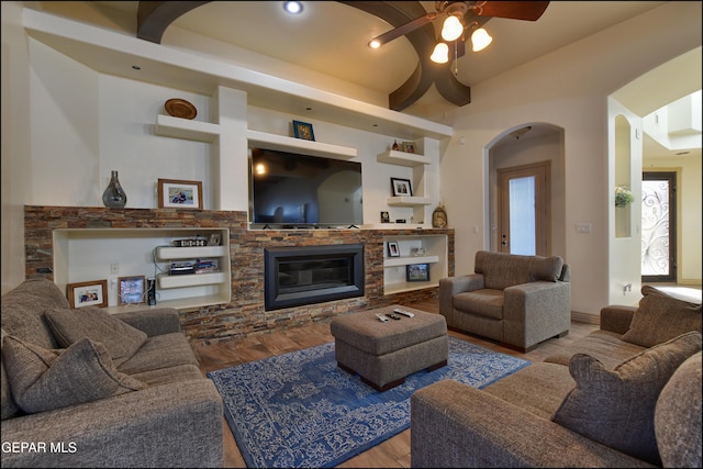 living room featuring ceiling fan and light wood-type flooring