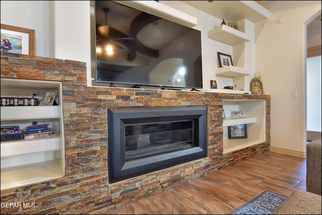 interior details featuring hardwood / wood-style flooring and built in features