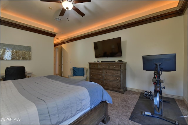 carpeted bedroom with ceiling fan and ornamental molding