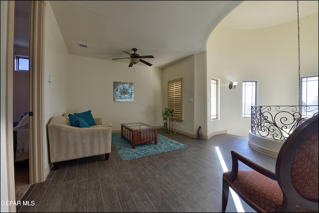 interior space featuring ceiling fan and dark hardwood / wood-style floors