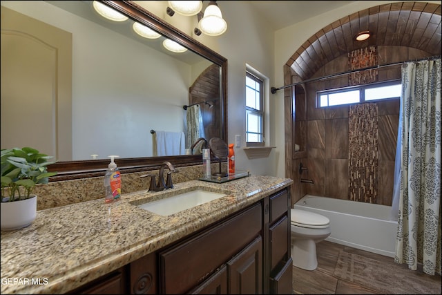 full bathroom featuring vanity, toilet, and shower / bath combo with shower curtain