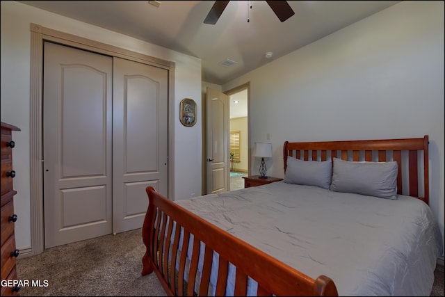 bedroom with ceiling fan, carpet flooring, and a closet