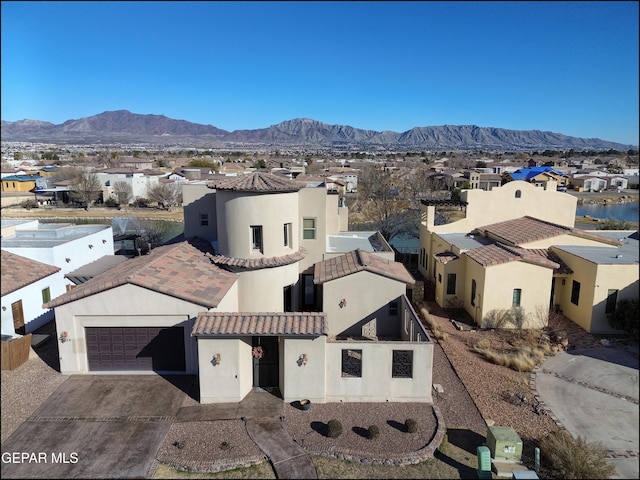 drone / aerial view featuring a mountain view