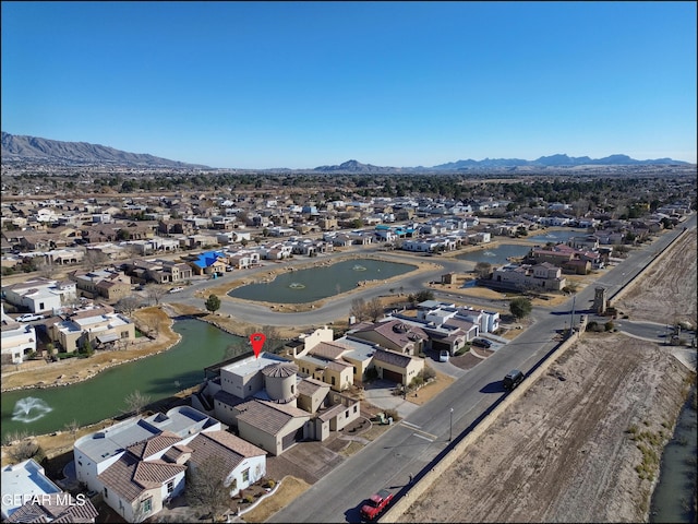 aerial view featuring a water and mountain view