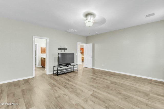 living room featuring ceiling fan and light hardwood / wood-style flooring