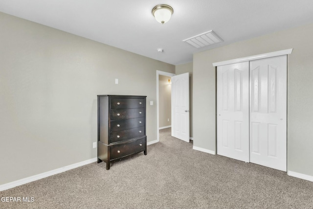 unfurnished bedroom with carpet and a closet