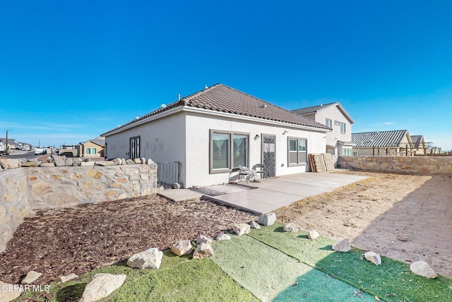 rear view of house with a patio area