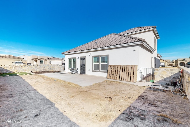 rear view of house featuring a patio area