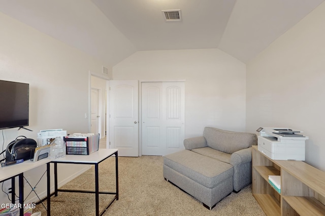 carpeted office with lofted ceiling