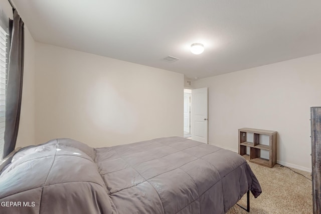 bedroom with light carpet