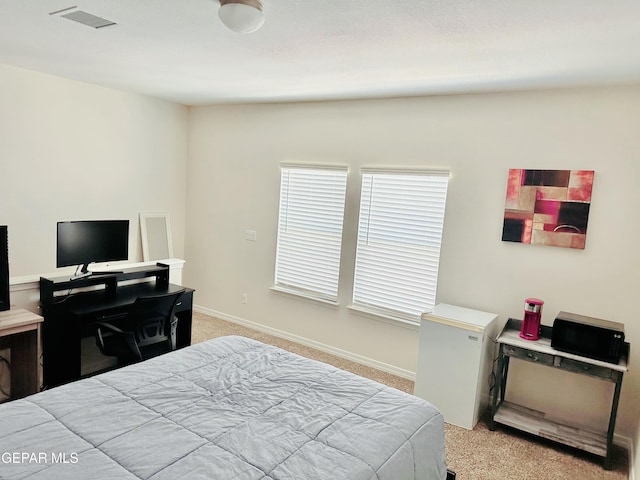 bedroom with light colored carpet