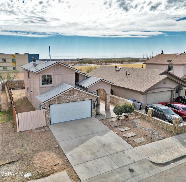 view of front of home with a garage and solar panels