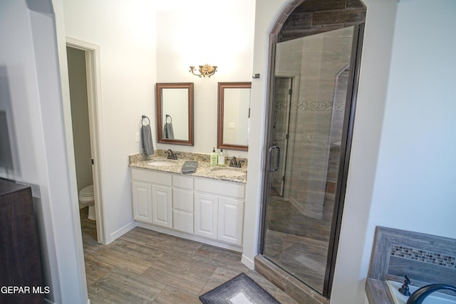 full bathroom featuring vanity, toilet, and separate shower and tub