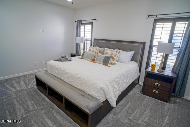 bedroom featuring dark colored carpet