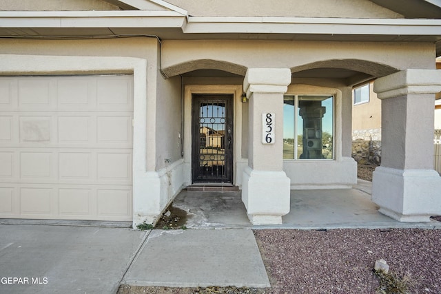 entrance to property featuring a garage