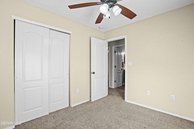 unfurnished bedroom with ceiling fan, carpet floors, and a closet