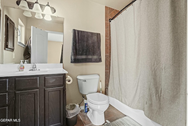 bathroom with vanity, tile patterned flooring, and toilet