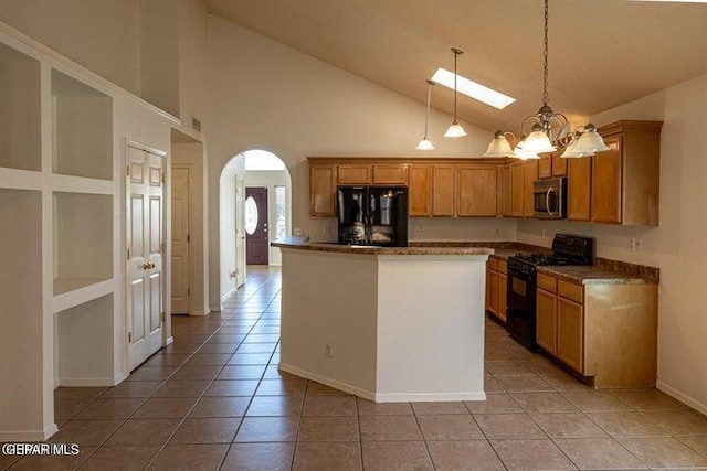 kitchen featuring pendant lighting, high vaulted ceiling, a center island, light tile patterned floors, and black appliances