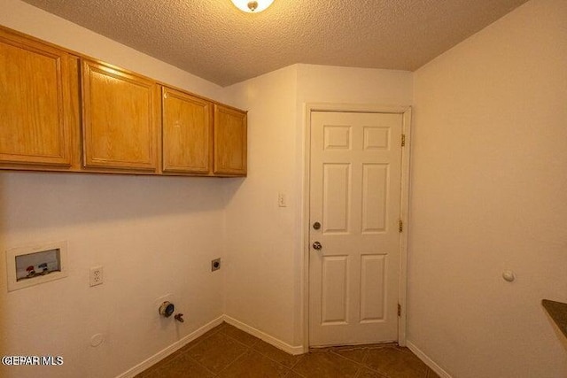 laundry area featuring gas dryer hookup, cabinets, washer hookup, and electric dryer hookup