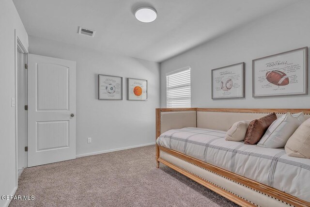 bedroom with light colored carpet