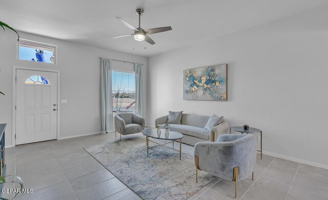 tiled living room with ceiling fan