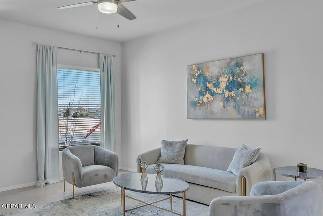 tiled living room featuring ceiling fan