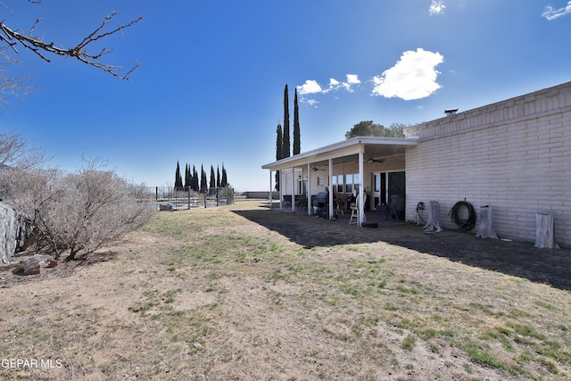 view of yard featuring ceiling fan