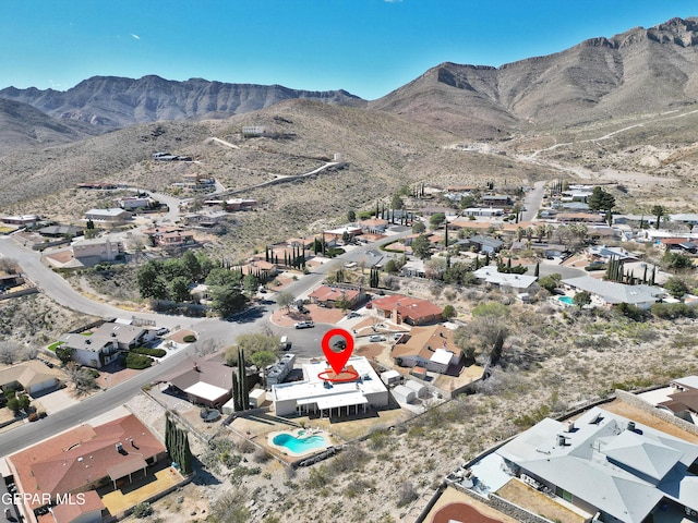 birds eye view of property featuring a mountain view