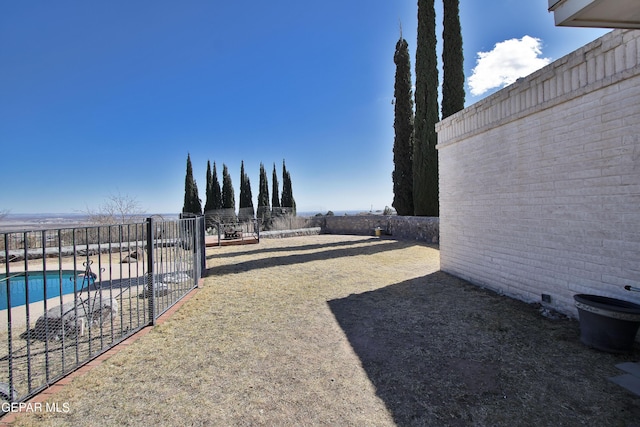 view of yard featuring a fenced in pool