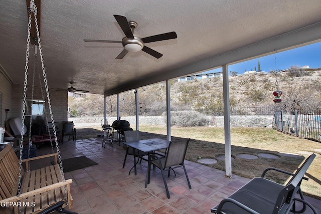 view of patio / terrace featuring ceiling fan