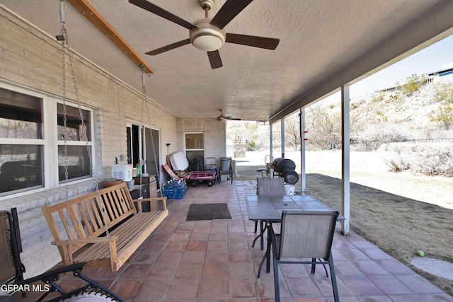 view of patio / terrace featuring ceiling fan