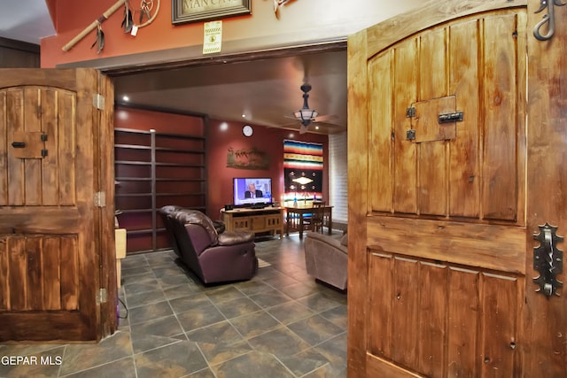 living room featuring ceiling fan