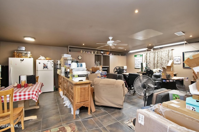 tiled living room with ceiling fan