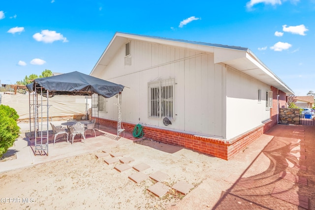 view of home's exterior featuring a patio