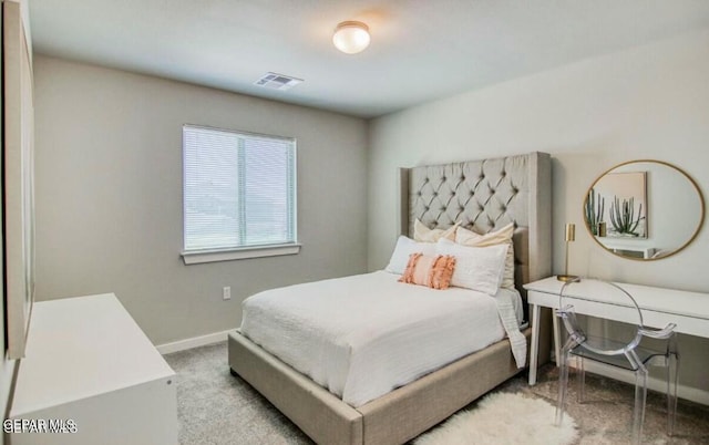 bedroom featuring light colored carpet