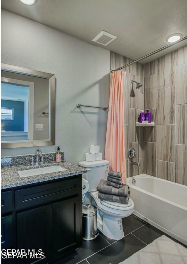 full bathroom with tile patterned flooring, vanity, shower / bath combination with curtain, and toilet