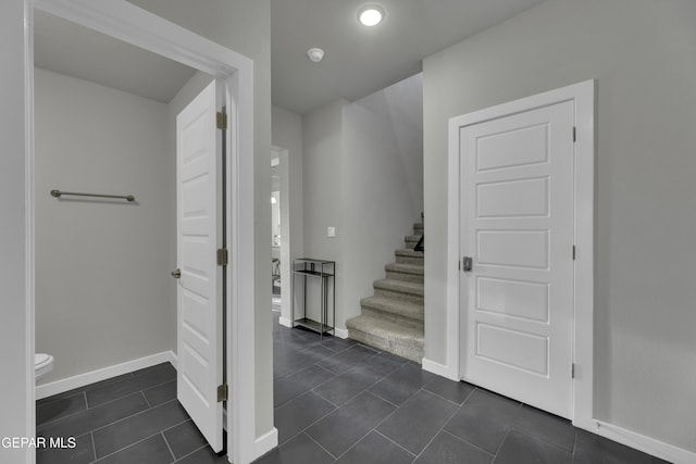 stairway with tile patterned flooring