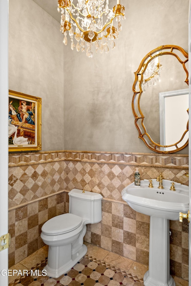 bathroom with tile walls, tile patterned flooring, and toilet