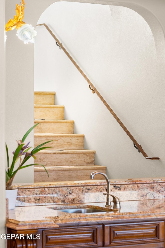 stairs featuring sink