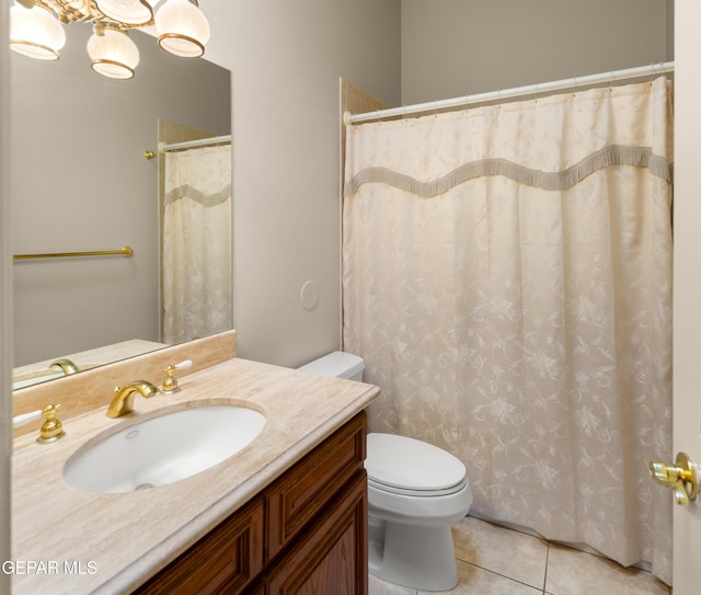 bathroom featuring tile patterned floors, toilet, and vanity