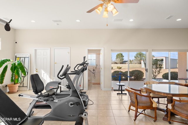 workout area with light tile patterned floors and ceiling fan