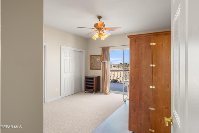 hallway featuring light carpet