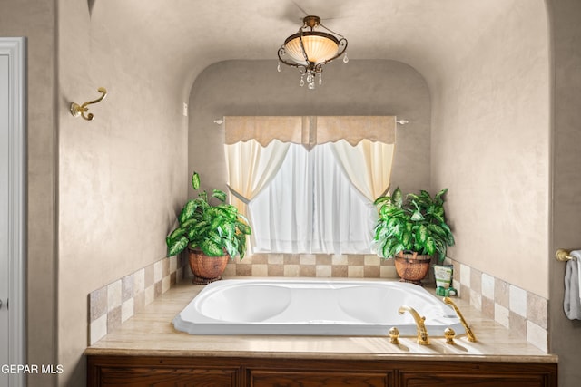 bathroom featuring a tub to relax in