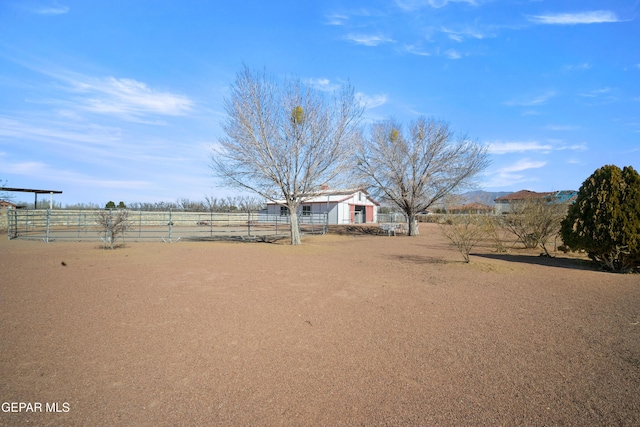 view of yard with a mountain view and a rural view