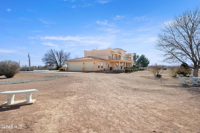 view of side of property with a garage