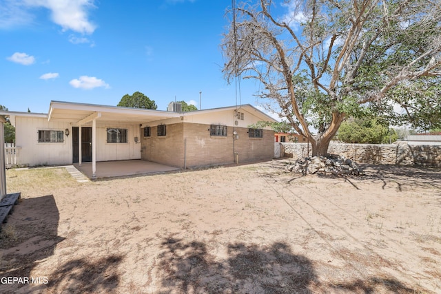 back of property with a patio area