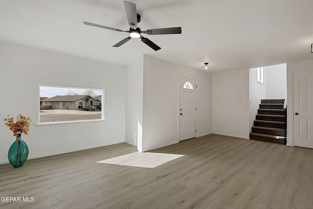 foyer featuring ceiling fan, plenty of natural light, and light hardwood / wood-style floors