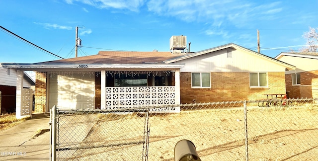 view of side of home with central AC unit