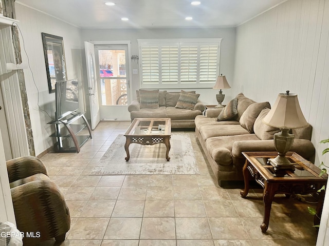 tiled living room with crown molding and wood walls