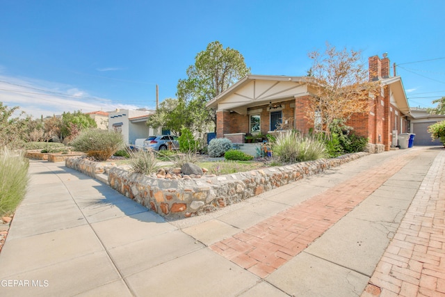 view of front of home featuring a garage and a porch